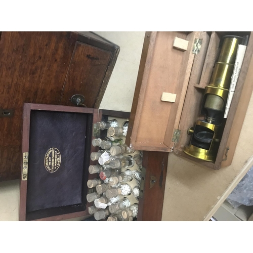 754 - A Georgian oak apothecary box various bottles one other apothecary box and microscope.