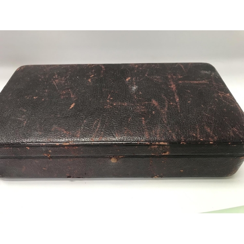 765 - A case containing surgical instruments.