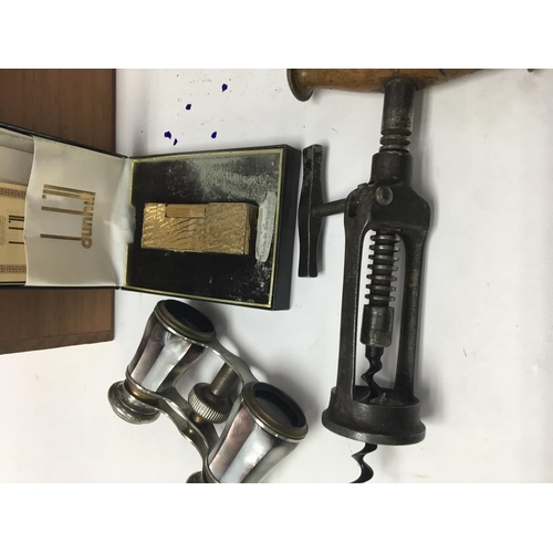 784 - A Dunhill lighter and a box of lighters various. Together with a pair of opera glasses and a corkscr... 