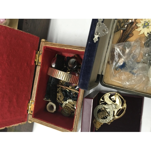 785 - A Work box containing costume jewellery various including watches and cap badges.
