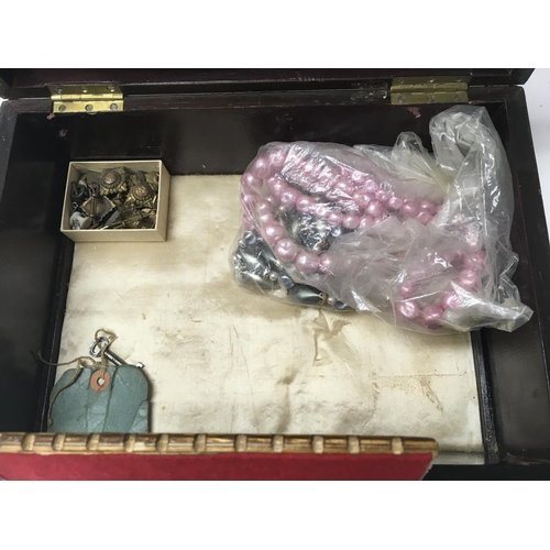 785 - A Work box containing costume jewellery various including watches and cap badges.