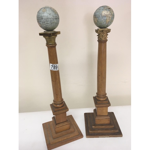 789 - Two Masonic early 20th century columns. Each surmounted with three inch Johnstons globes one of the ... 