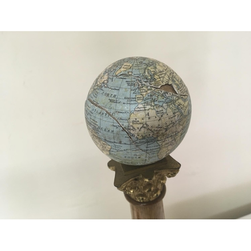 789 - Two Masonic early 20th century columns. Each surmounted with three inch Johnstons globes one of the ... 