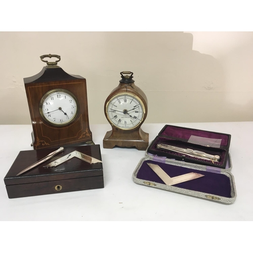 790 - An Edwardian inlaid mahogany mantel clock a walnut clock and a quantity of silver plated Masonic too... 