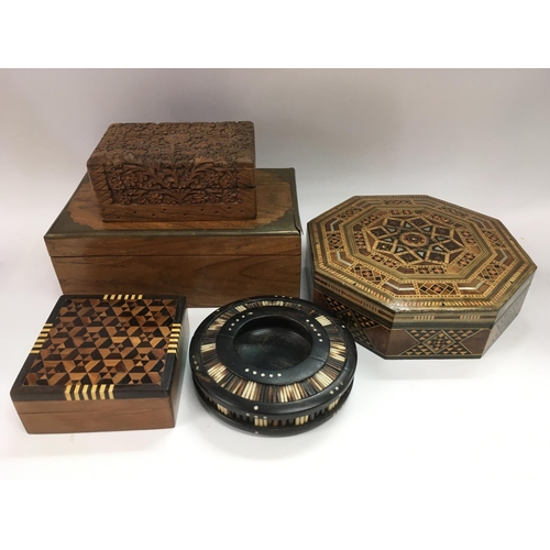 793 - A collection of boxes including an octagonal parquetry box, a brass bound cedar wood box etc.