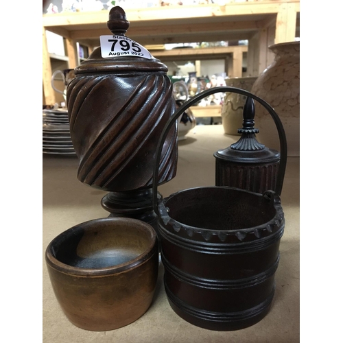 795 - A collection of Treen items including two jars and covers, a miniature pale and a small bowl