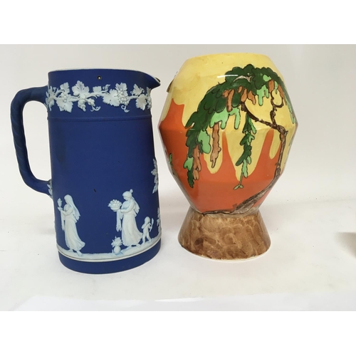 1007 - An Art Deco Memory Lane Wilkinson vase and a Wedgwood Jasper ware jug.