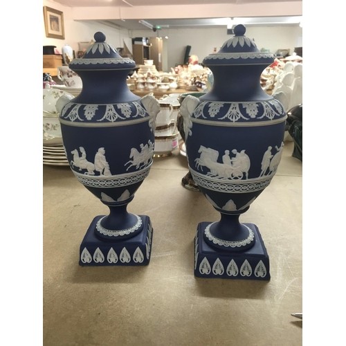 1048 - A pair of jasper ware Adams vases decorated with classical scenes and seven other vases .