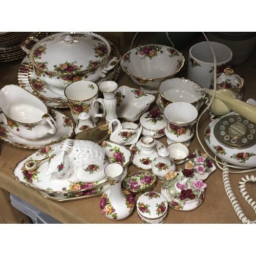 1065 - An Extensive Royal Albert old English country rose tea and dinner set. With a comport telephone tabl... 