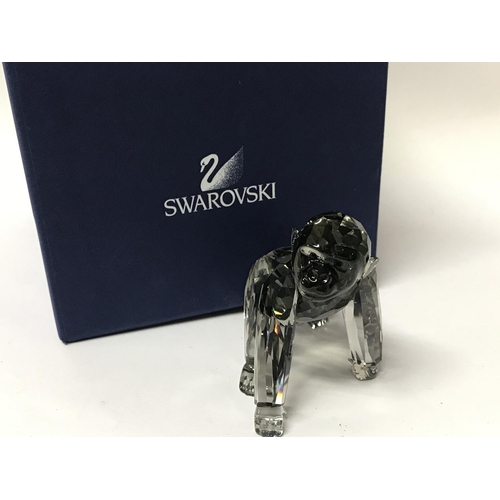 1083 - A Boxed Swarovski figure of Gorillas