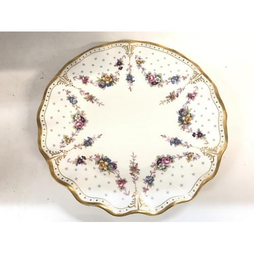 1105 - A royal crown derby plate and small dish.