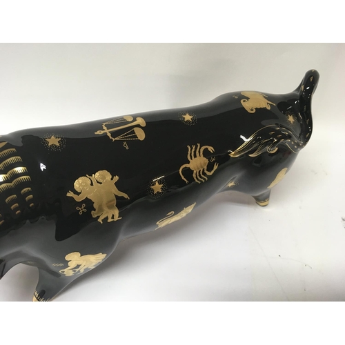 1110 - A Wedgwood Taurus the bull , with gilt signs of the zodiac m designed by 
Arnold Machin  38 cm long ... 