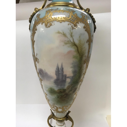 1113 - A 19 th century French porcelain vase the central panel with figures and 
Landscape views . 50 cm