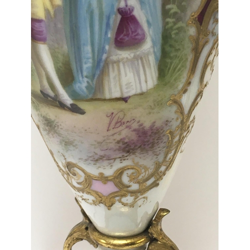 1113 - A 19 th century French porcelain vase the central panel with figures and 
Landscape views . 50 cm