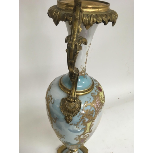 1113 - A 19 th century French porcelain vase the central panel with figures and 
Landscape views . 50 cm