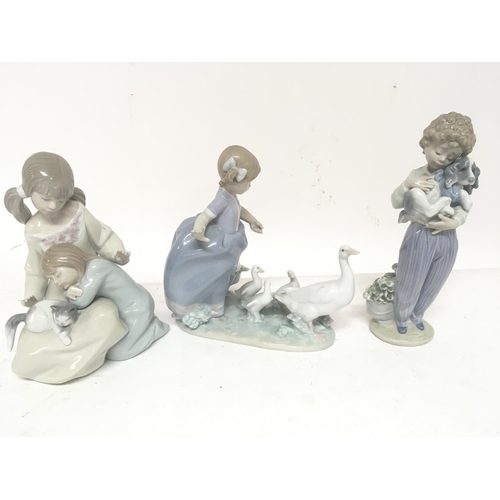 1147 - Three Lladro figure groups of children with animals.damage . (3)