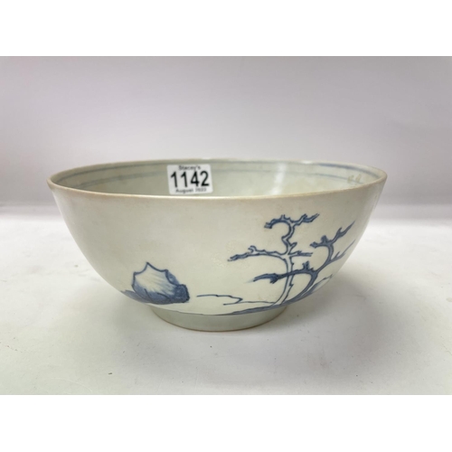 1161 - A Nanking cargo blue and white bowl decorated with landscape view .