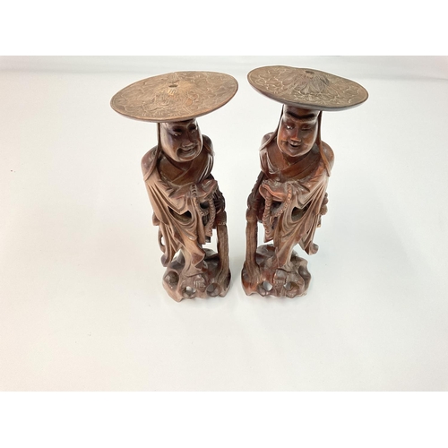 1163 - A pair of antique oriental carved figures, approximately 33cm tall. NO RESERVE