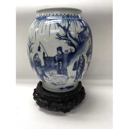 1165 - A Chinese Kangxi blue and white Baluster  vase  decorated with figures amongst a landscape  view .
S... 