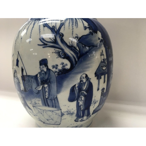 1165 - A Chinese Kangxi blue and white Baluster  vase  decorated with figures amongst a landscape  view .
S... 