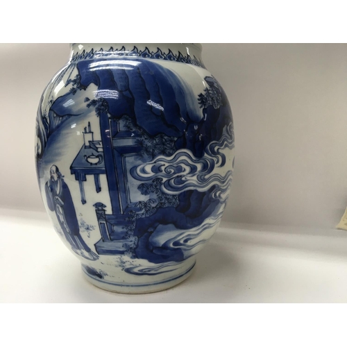 1165 - A Chinese Kangxi blue and white Baluster  vase  decorated with figures amongst a landscape  view .
S... 