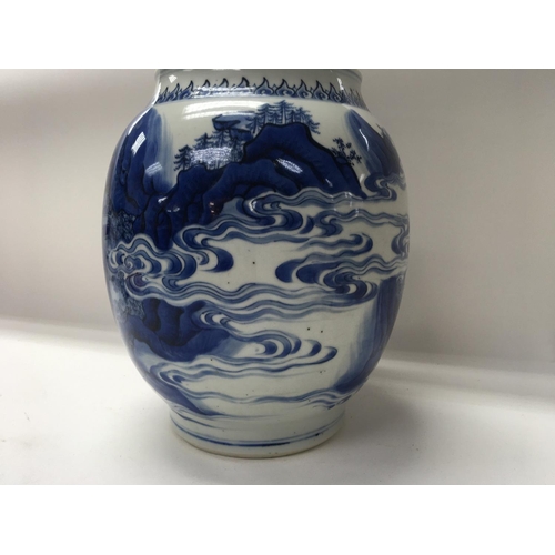 1165 - A Chinese Kangxi blue and white Baluster  vase  decorated with figures amongst a landscape  view .
S... 