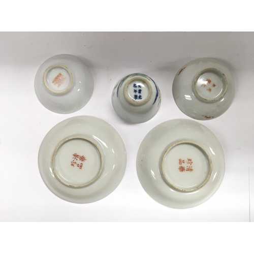 1194 - A small collection of tea bowls and dishes.