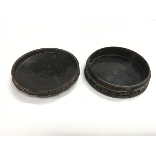 1196 - A circular tortoishell box and cover, approx diameter 9cm.