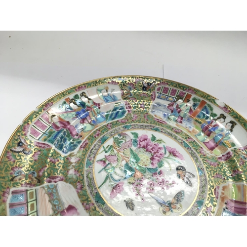 1197 - Four Canton plates comprising a pair with a centralised image of butterflies and flowers and two oth... 