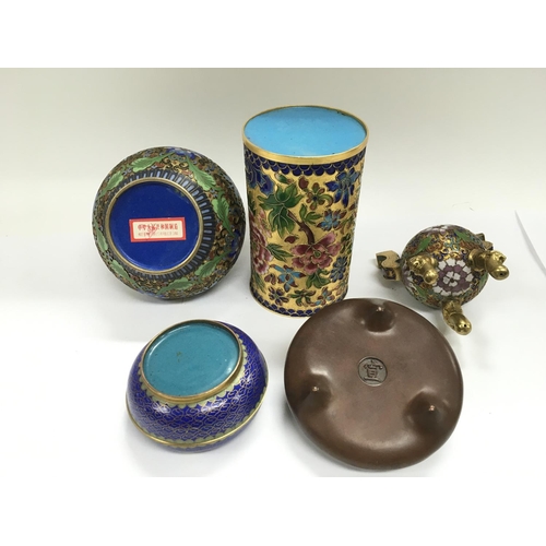 1200 - A collection of Oriental items comprising Cloisonne examples, a bronze pot etc.