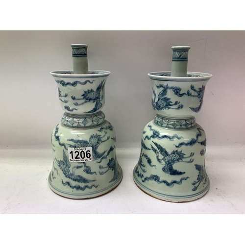 1206 - 2 oriental blue and white Temple bell shaped candlesticks, 25cm.