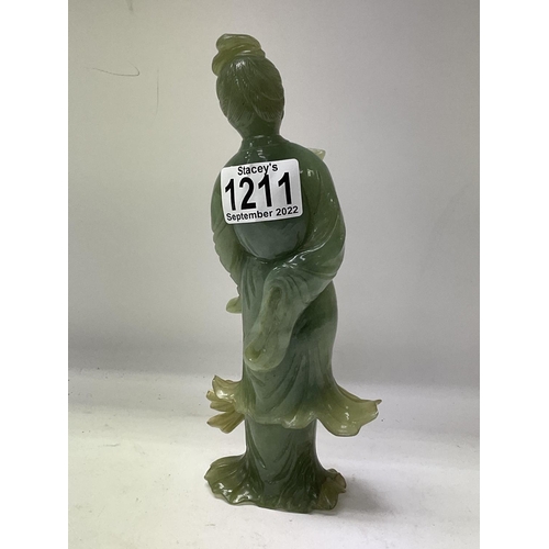 1211 - A Chinese green Jade figurine of a court dancer.