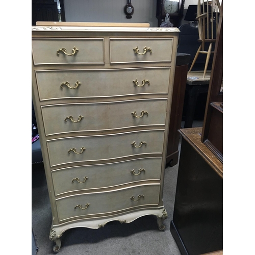 1253 - A light walnut chest of drawers fitted with two short and five long drawers
On cabriole legs .