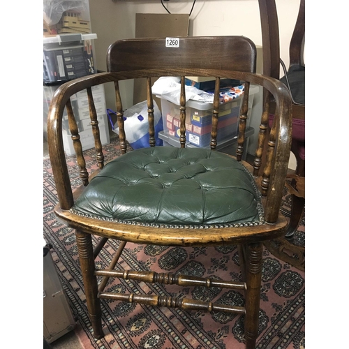 1260 - An Edwardian office desk bentwood arm chair with green leather upholstered seat.