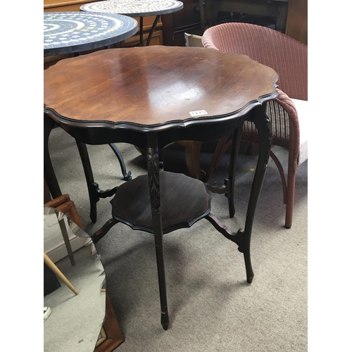 1290 - An Edwardian mahogany occasional table with a shaped top on splayed legs United by an under-shelf NO... 