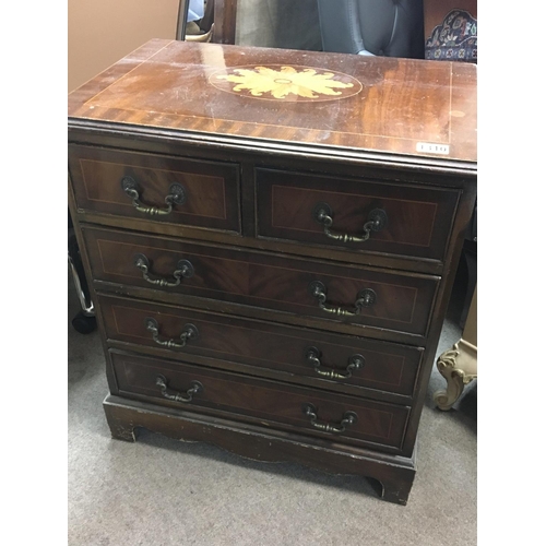 1310 - A 20th century small mahogany chest of drawers fitted with two short and three long drawers.