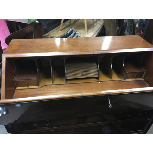 1314 - A Yew wood bureau with a well fitted interior above four graduating drawers.