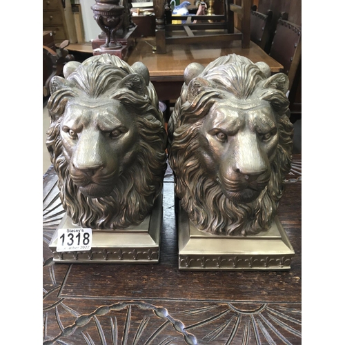 1318 - Two pairs of bookends in the form lion heads .