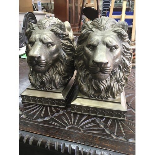 1318 - Two pairs of bookends in the form lion heads .