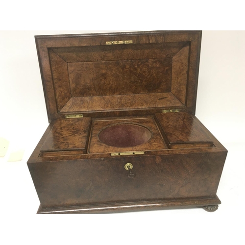 1322 - A Quality Early Victorian walnut tea caddy with a well fitted interior and two sections.