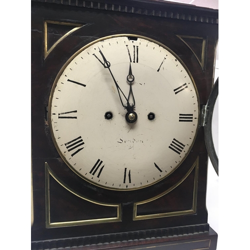 1334 - A Georgian mahogany bracket clock, circular dial with Roman numerals. Maker William Hurst