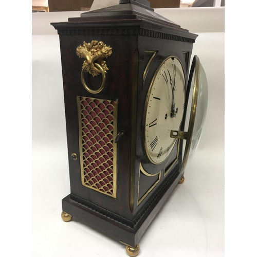 1334 - A Georgian mahogany bracket clock, circular dial with Roman numerals. Maker William Hurst