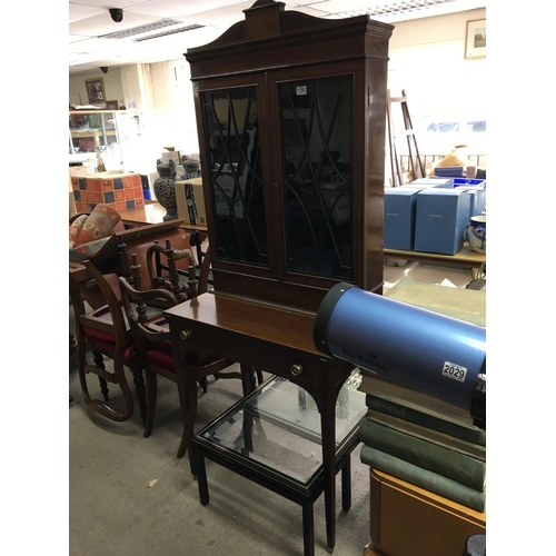 1350 - An Edwardian inlaid mahogany bureau bookcase having glazed doors above a single drawer on square tap... 