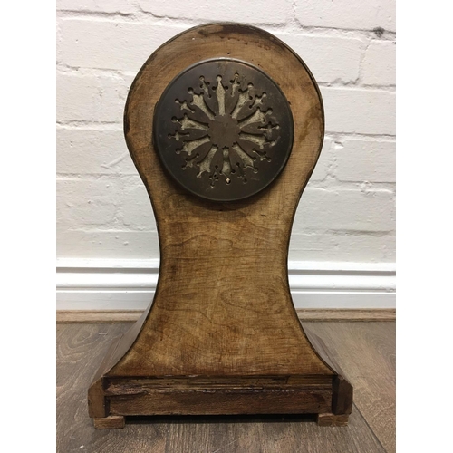 1352 - A Edwardian mahogany mantle clock, the circular dial with Roman numerals and Mercury pendulum