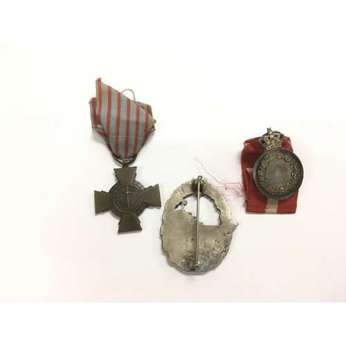 1602 - Three medals comprising a Danish example, one French and a Third Reich naval example.