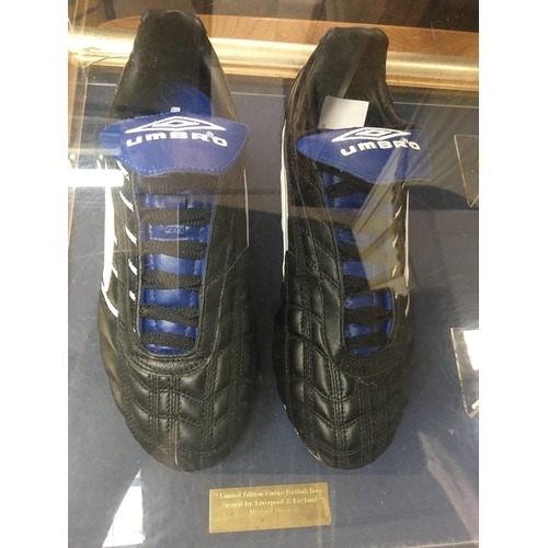 1763 - A display case containing Michael Owen's football boots