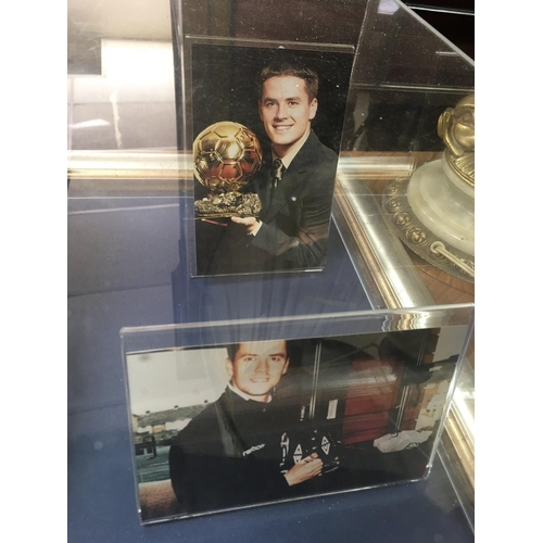 1763 - A display case containing Michael Owen's football boots