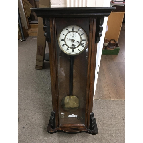 1944 - A mahogany cased wall clock with white enamel dial and Roman numerals. NO RESERVE