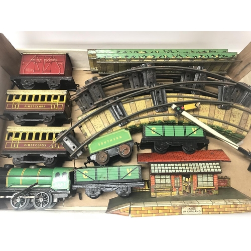 1982 - Box of vintage tin-plate 'O' Gauge railway items including small Loco and tender carriages, trucks, ... 