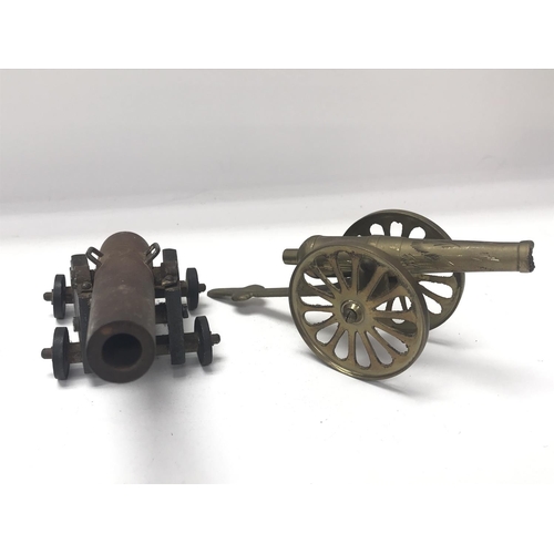 1991 - Small old model cannon with metal barrel and base and small brass cannon